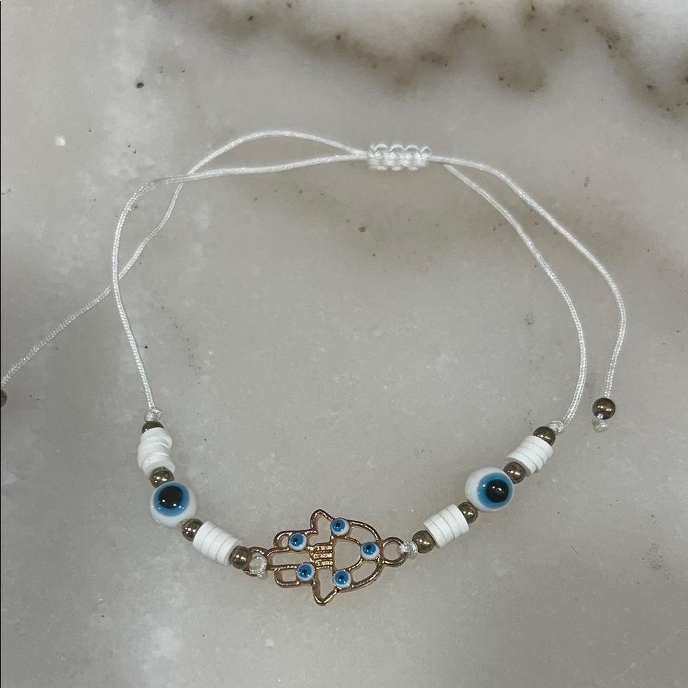 Chic Gold and White Hamsa Bracelet with Blue Accents